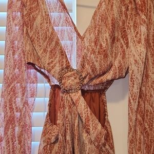 Chic Red and White Patterned Maxi Dress with Gold Buckle